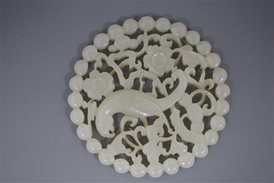 A fine Chinese white jade disc, 18th/19th century, D. 5.7cm